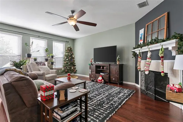 a living room with furniture and a flat screen tv