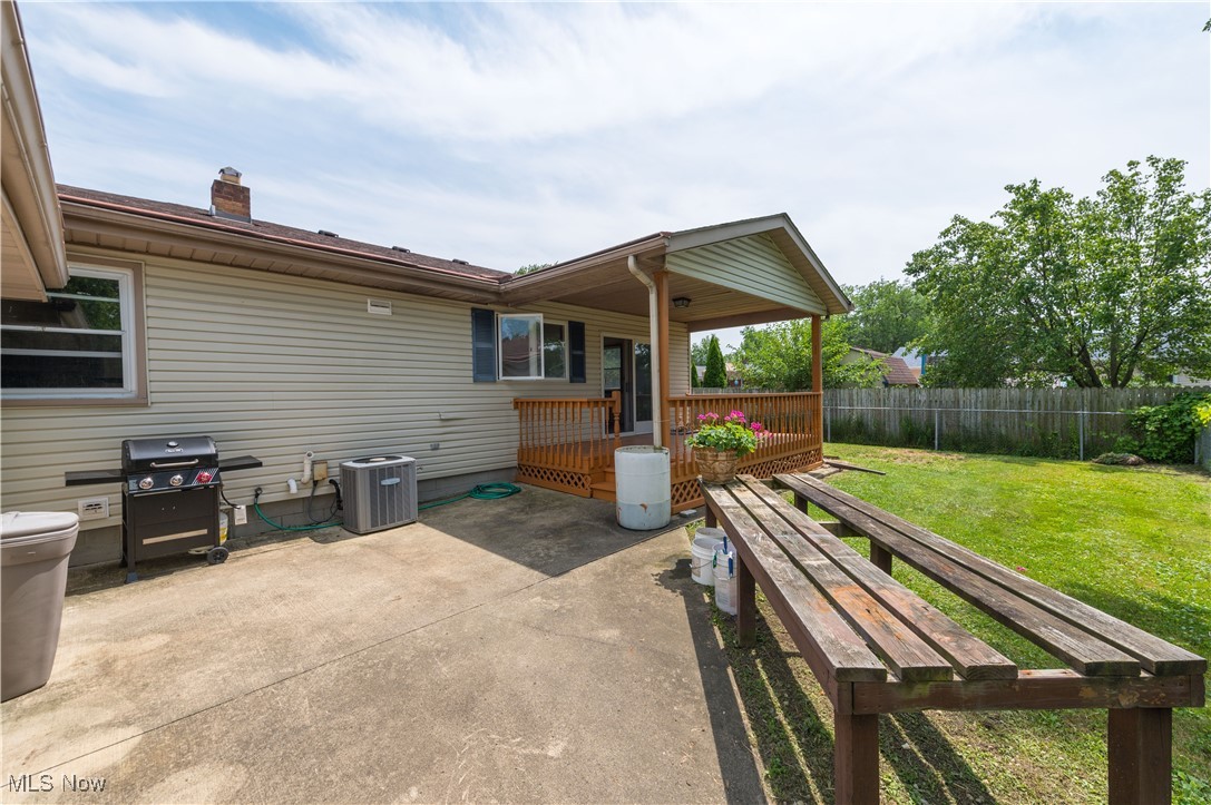 1140 West River Road Vermilion, OH 44089 - Photo 36 of 49 View of patio with area for grilling and a wooden deck