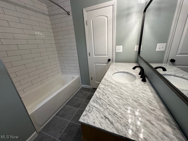 9109 Johnnycake Ridge Road Mentor, OH 44060 - Photo 6 of 28 Bathroom with vanity, shower / bathtub combination, and dark tile patterned flooring