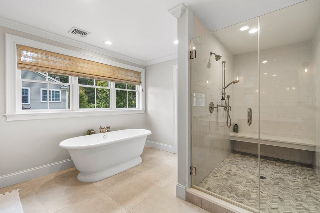 45 Bancroft Street Needham, MA 02492 - Photo 13 of 24 a bathroom with a bathtub and a shower