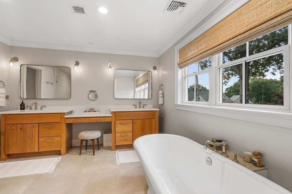 45 Bancroft Street Needham, MA 02492 - Photo 14 of 24 a spacious bathroom with a granite countertop sink mirror and bathtub