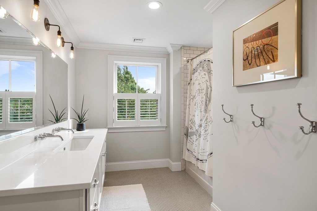45 Bancroft Street Needham, MA 02492 - Photo 18 of 24 a bathroom with a bathtub and a sink