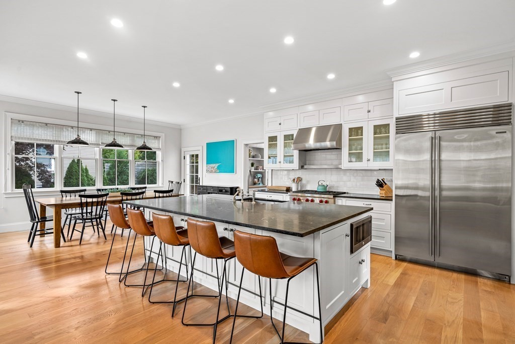 45 Bancroft Street Needham, MA 02492 - Photo 2 of 24 a kitchen with stainless steel appliances granite countertop a stove and a refrigerator