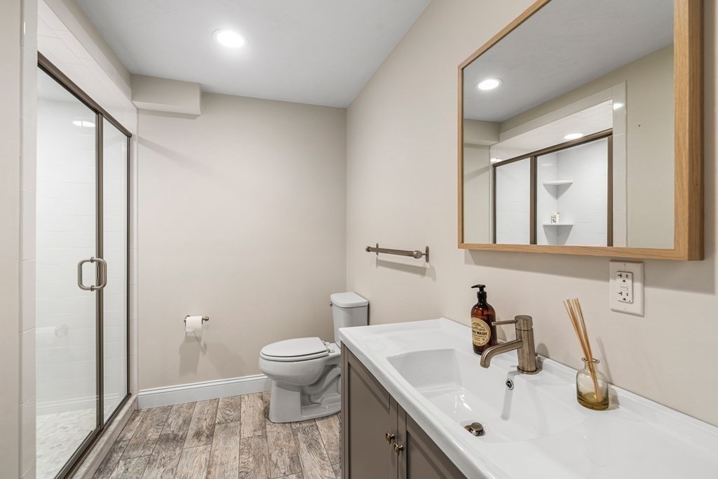 45 Bancroft Street Needham, MA 02492 - Photo 21 of 24 a bathroom with a sink toilet and shower