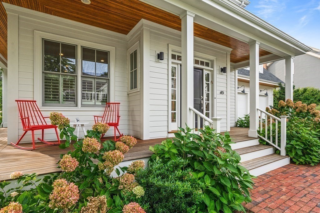 45 Bancroft Street Needham, MA 02492 - Photo 22 of 24 front view of a house with a bench