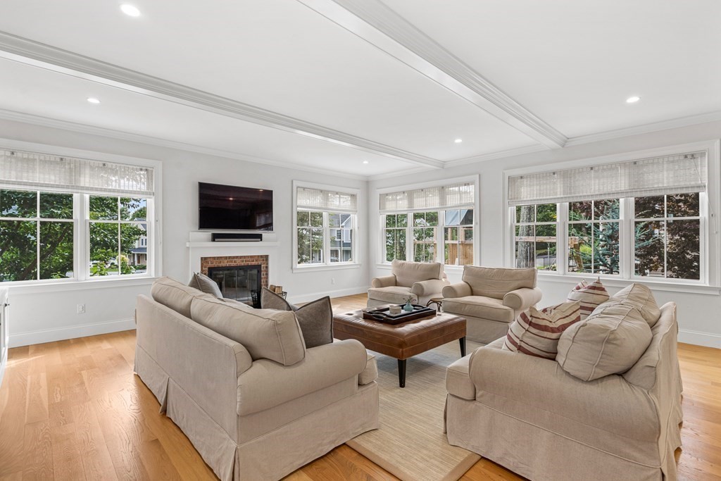 45 Bancroft Street Needham, MA 02492 - Photo 6 of 24 a living room with furniture and a flat screen tv