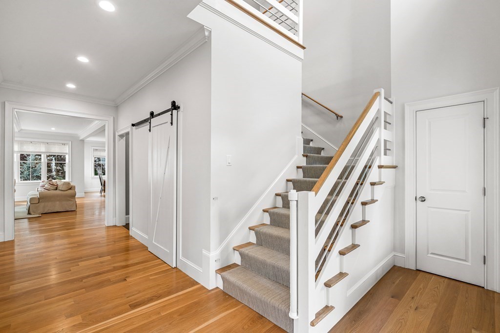 45 Bancroft Street Needham, MA 02492 - Photo 10 of 24 a view of entryway with wooden floor and stairs