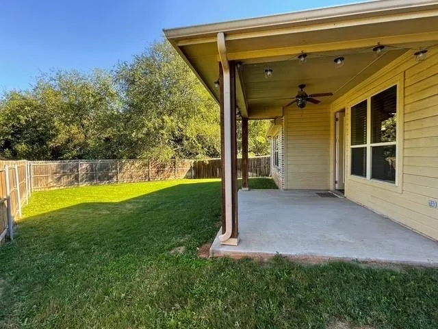 a view of a back yard of the house