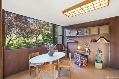 a view of a dining room with furniture window and outside view