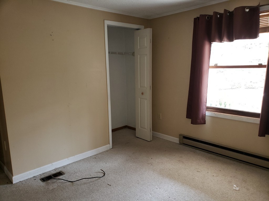 60 Haggerty Road Charlton, MA 01507 - Photo 19 of 28 a view of an empty room with a window
