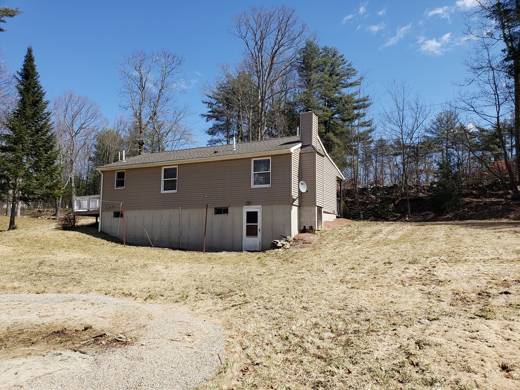 60 Haggerty Road Charlton, MA 01507 - Photo 2 of 28 a view of white house with a yard covered in snow