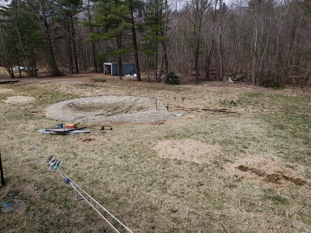 60 Haggerty Road Charlton, MA 01507 - Photo 23 of 28 a view of a backyard with large trees