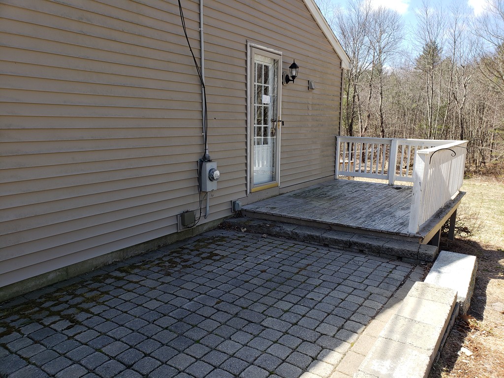 60 Haggerty Road Charlton, MA 01507 - Photo 27 of 28 a view of a backyard with a wooden fence