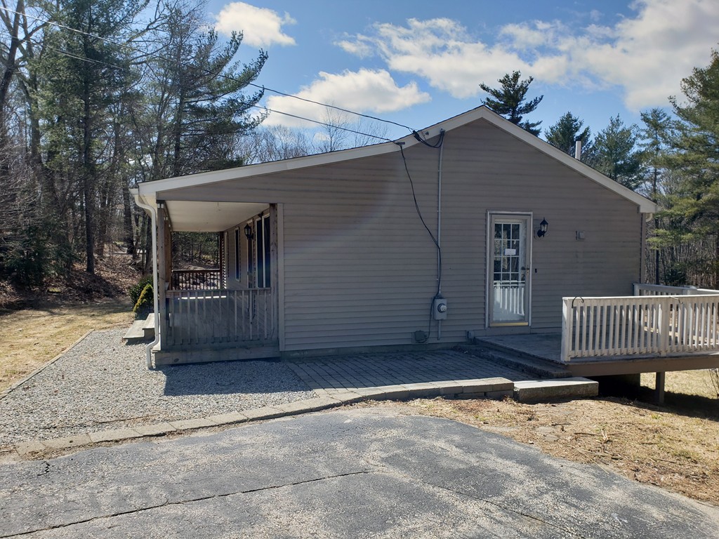60 Haggerty Road Charlton, MA 01507 - Photo 4 of 28 a view of a house with a yard and wooden fence