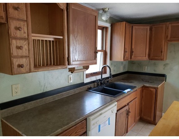 60 Haggerty Road Charlton, MA 01507 - Photo 6 of 28 a kitchen with a sink and cabinets