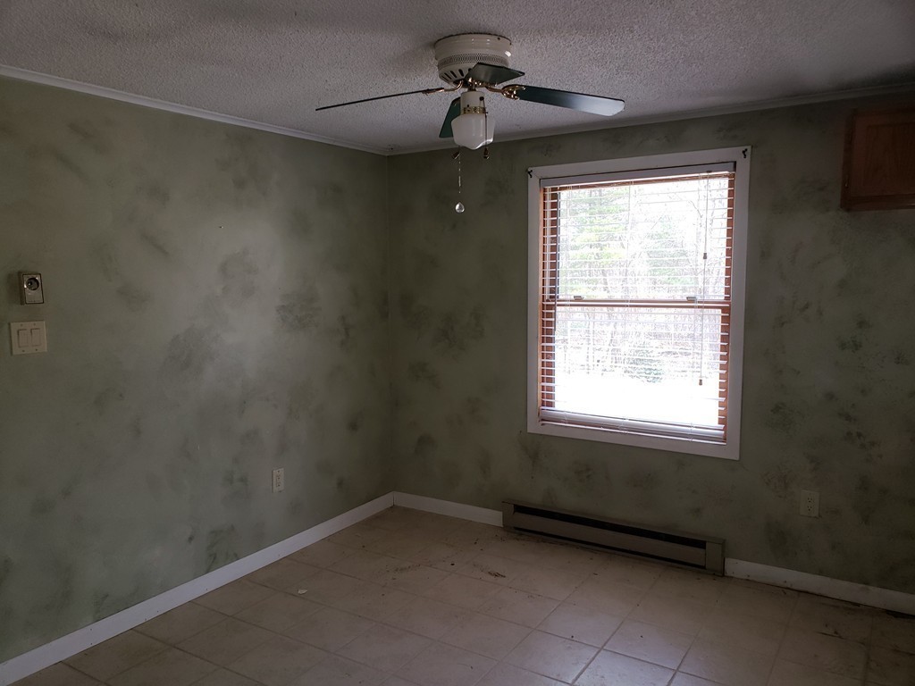 60 Haggerty Road Charlton, MA 01507 - Photo 10 of 28 a view of an empty room with a window
