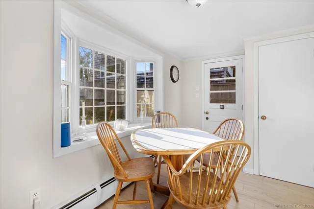 a dining room with furniture and window