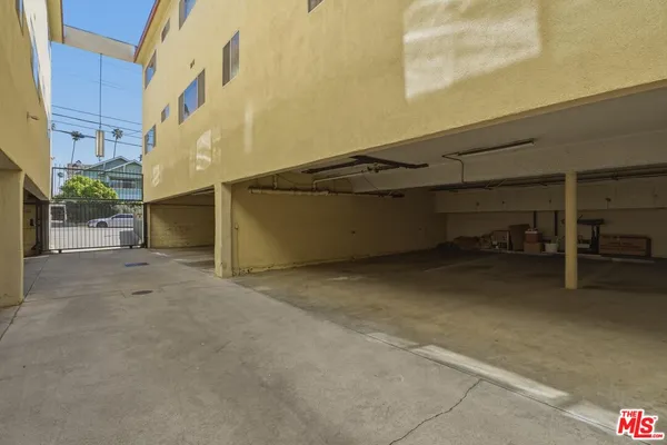 a front view of a house with plants