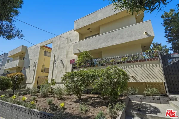 a view of balcony with wooden floor and seating space