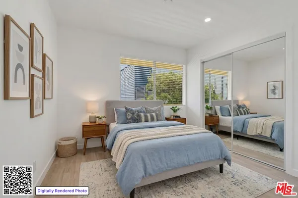 a bedroom with a bed and a couch