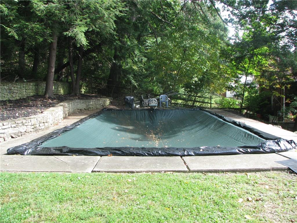 1101 Isabella Road Connellsville, PA 15425 - Photo 22 of 25 A 32 x 16 foot in ground swimming pool is in the back on an upper terraced lawn.