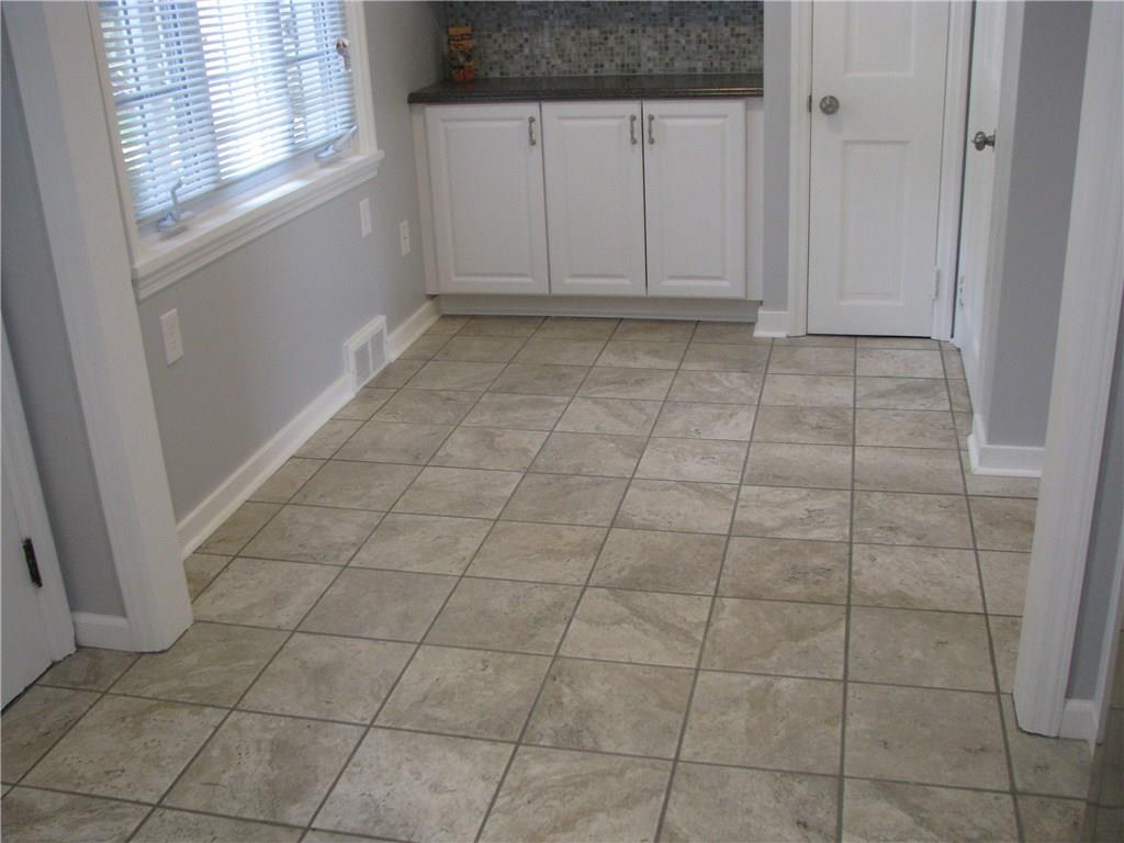 1101 Isabella Road Connellsville, PA 15425 - Photo 5 of 25 New ceramic flooring makes for a light and bright kitchen.