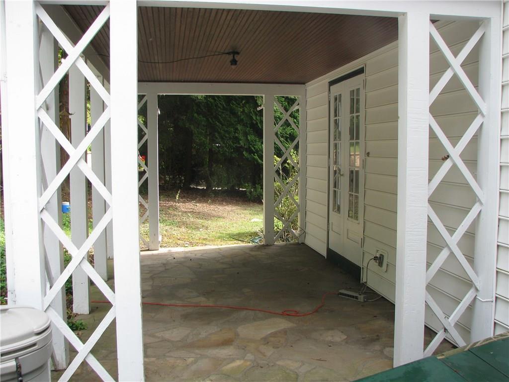 1101 Isabella Road Connellsville, PA 15425 - Photo 7 of 25 French doors open up to a flagstone patio.