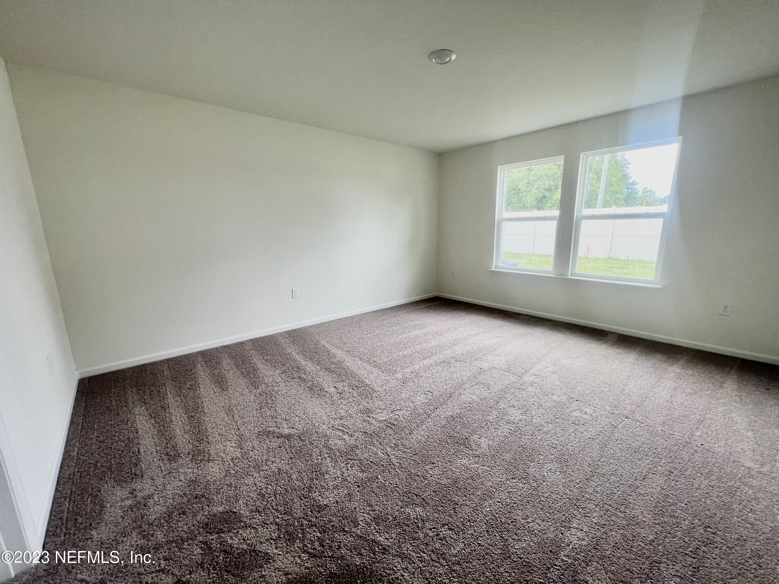 7954 Rippa Valley Way Jacksonville, FL 32222 - Photo 3 of 9 an empty room with a window