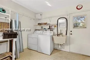 a utility room with dryer and washer