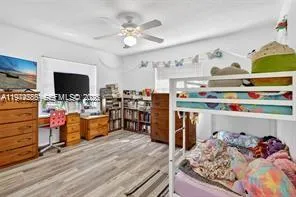 a living room with lots of furniture and a flat screen tv