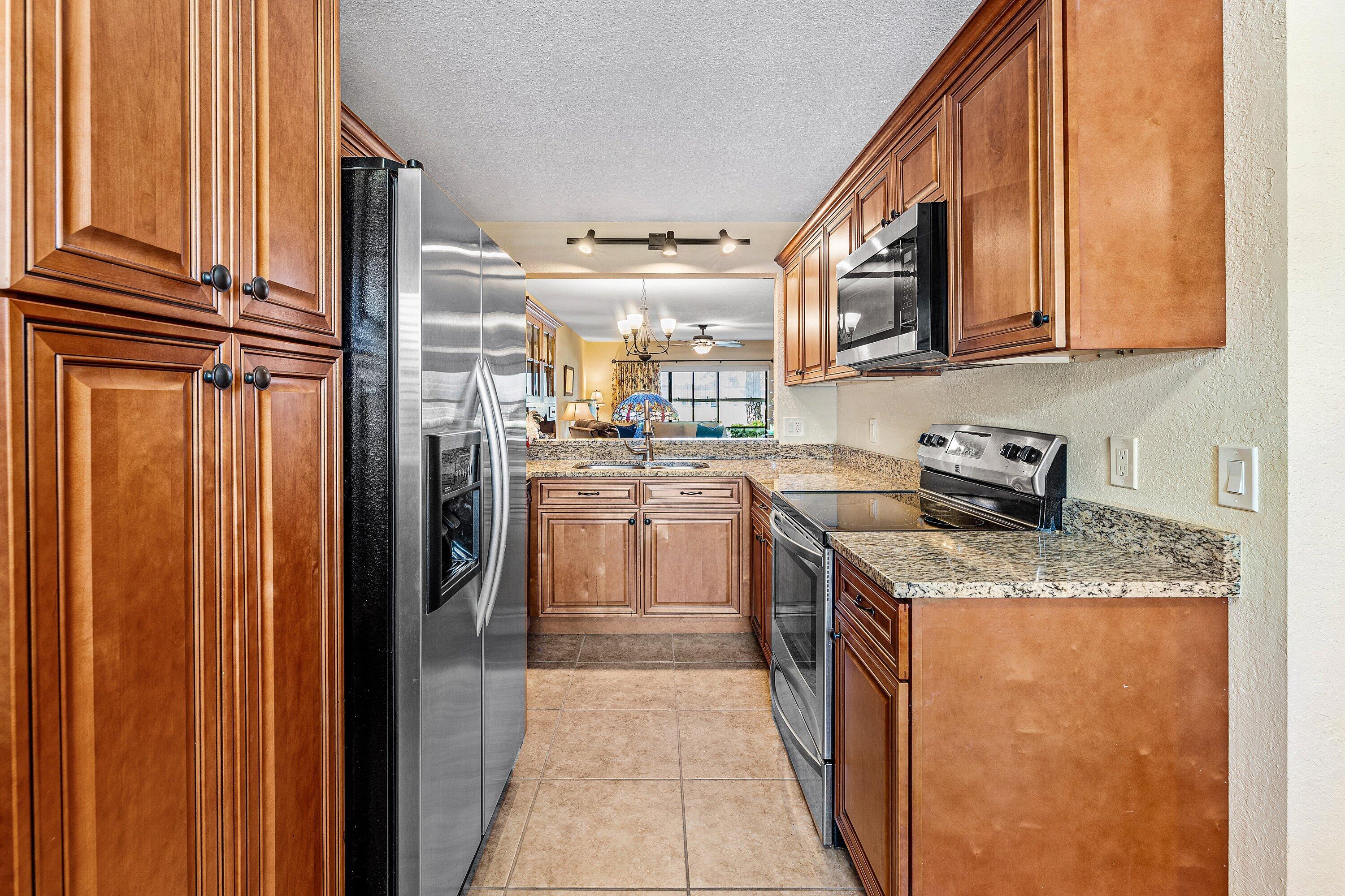 1111 Keystone Drive, Unit B Jupiter, FL 33458 - Photo 8 of 42 Newer Beautiful Granite Kitchen!