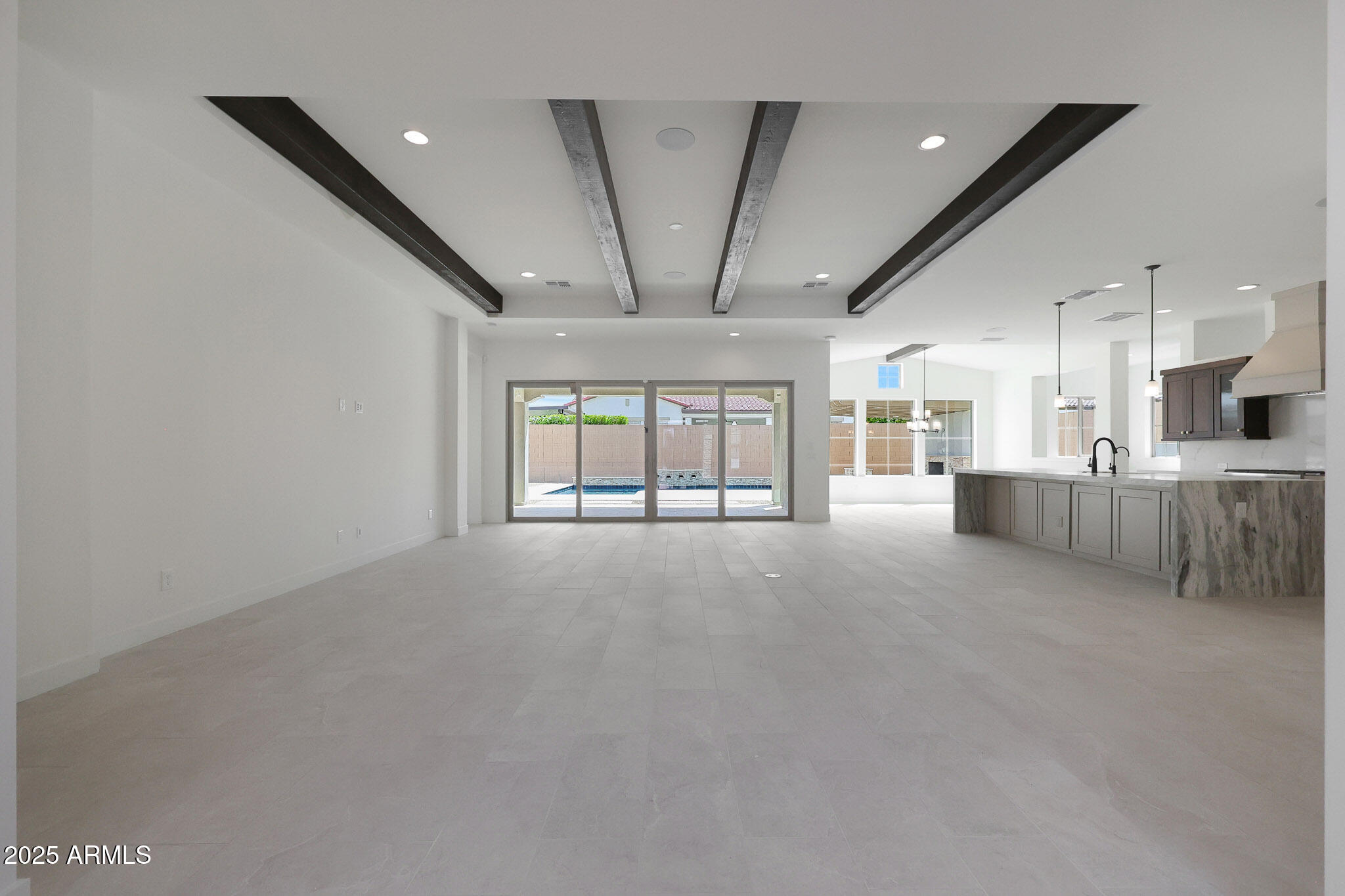 20775 West Rattler Road Buckeye, AZ 85396 - Photo 25 of 90 a view of an empty room with a window and fireplace