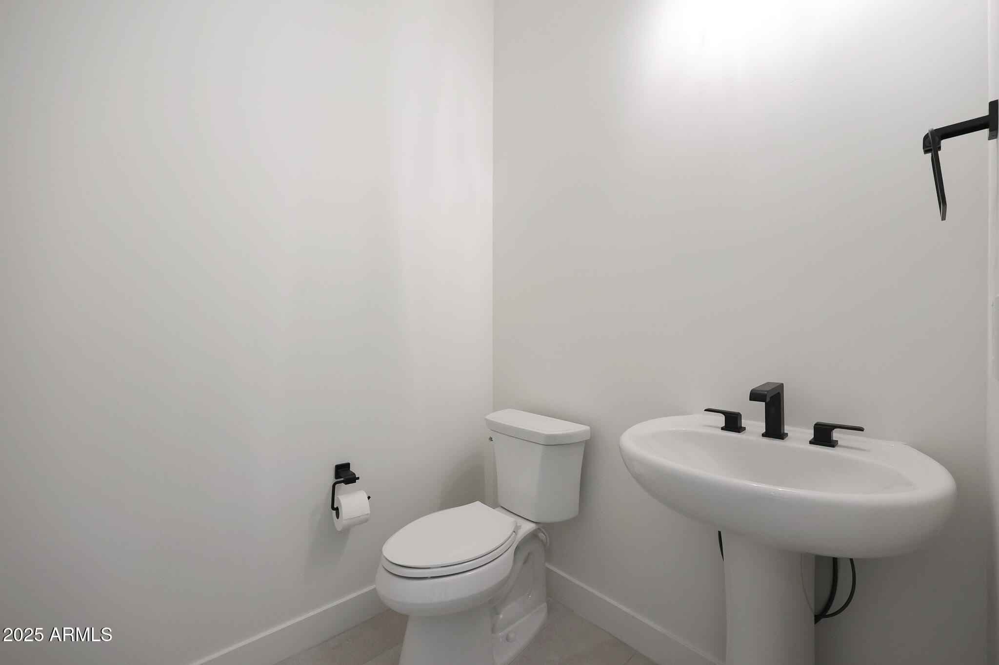 20775 West Rattler Road Buckeye, AZ 85396 - Photo 32 of 90 a bathroom with a sink and a toilet