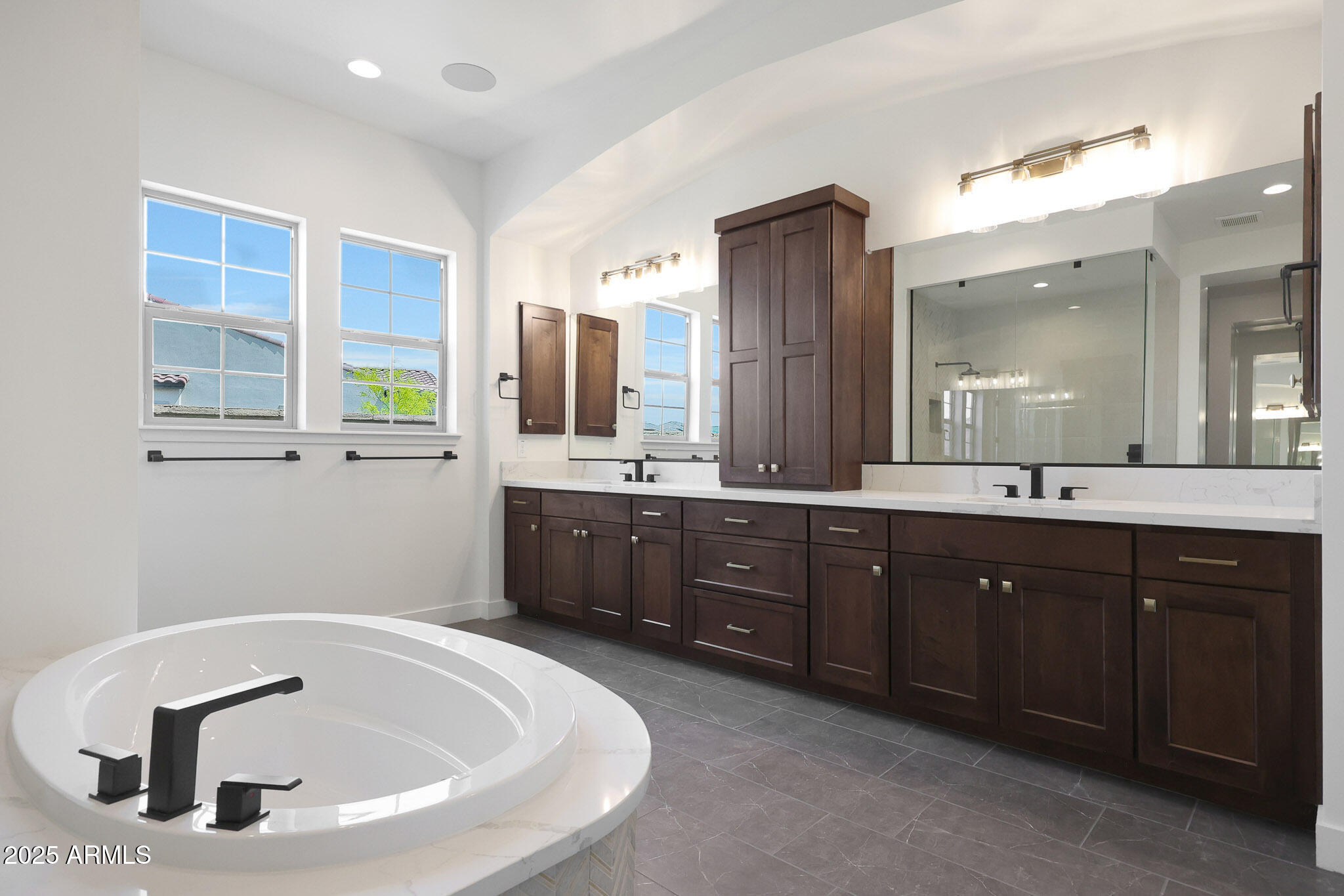 20775 West Rattler Road Buckeye, AZ 85396 - Photo 42 of 90 a bathroom with a tub sink and mirror