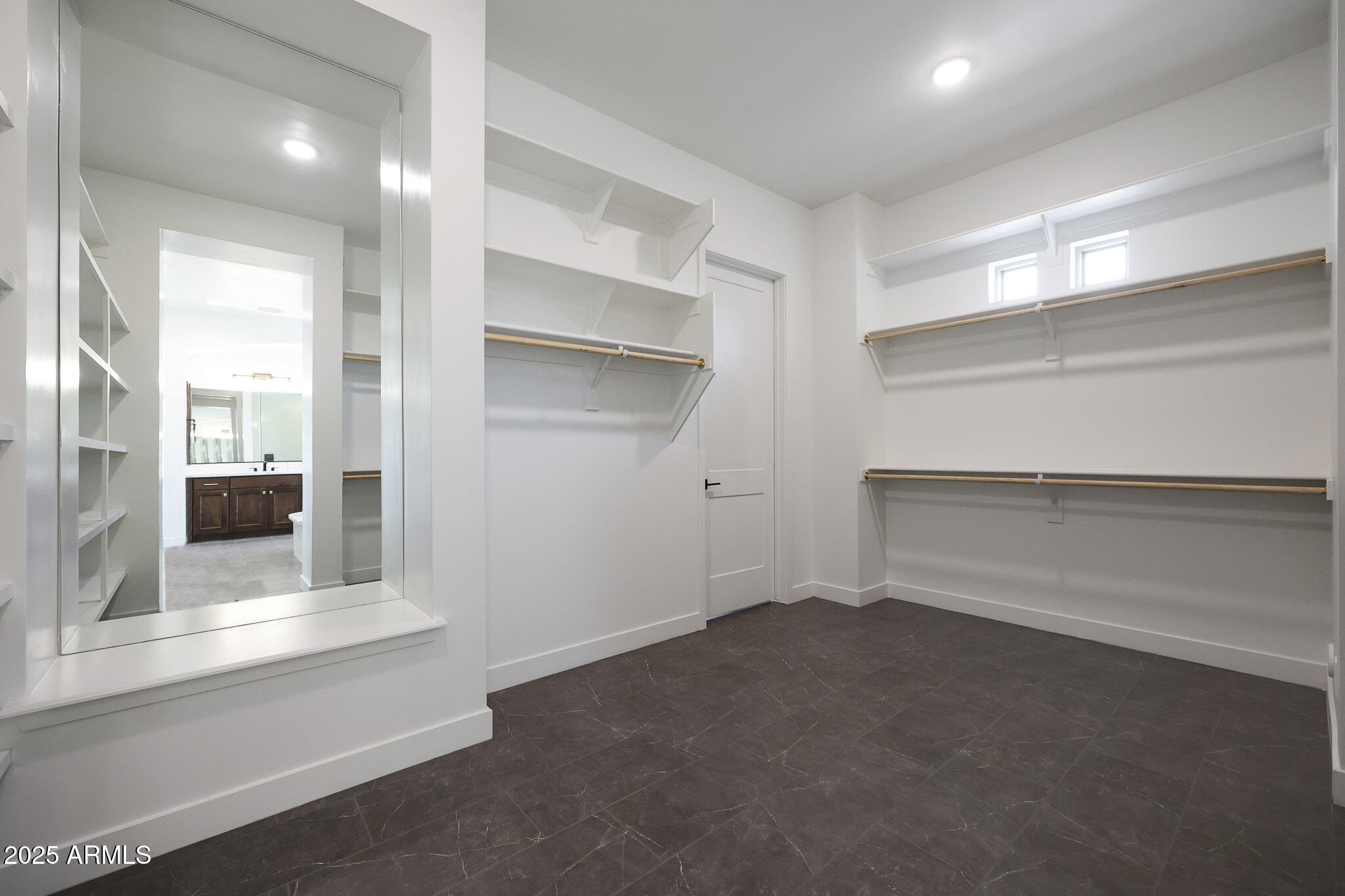 20775 West Rattler Road Buckeye, AZ 85396 - Photo 44 of 90 an empty room with wooden floor and windows