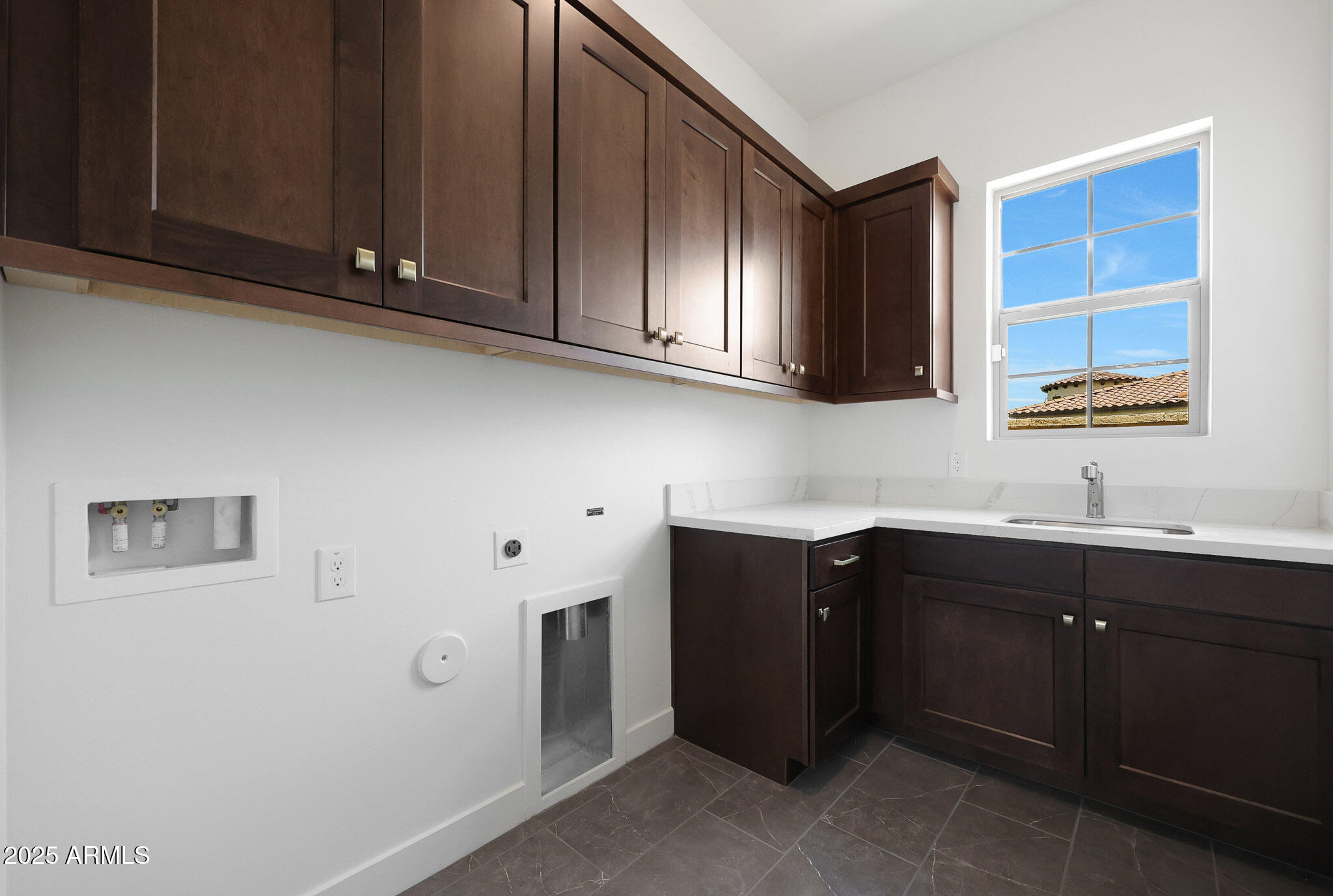 20775 West Rattler Road Buckeye, AZ 85396 - Photo 45 of 90 a kitchen with stainless steel appliances granite countertop cabinets and window