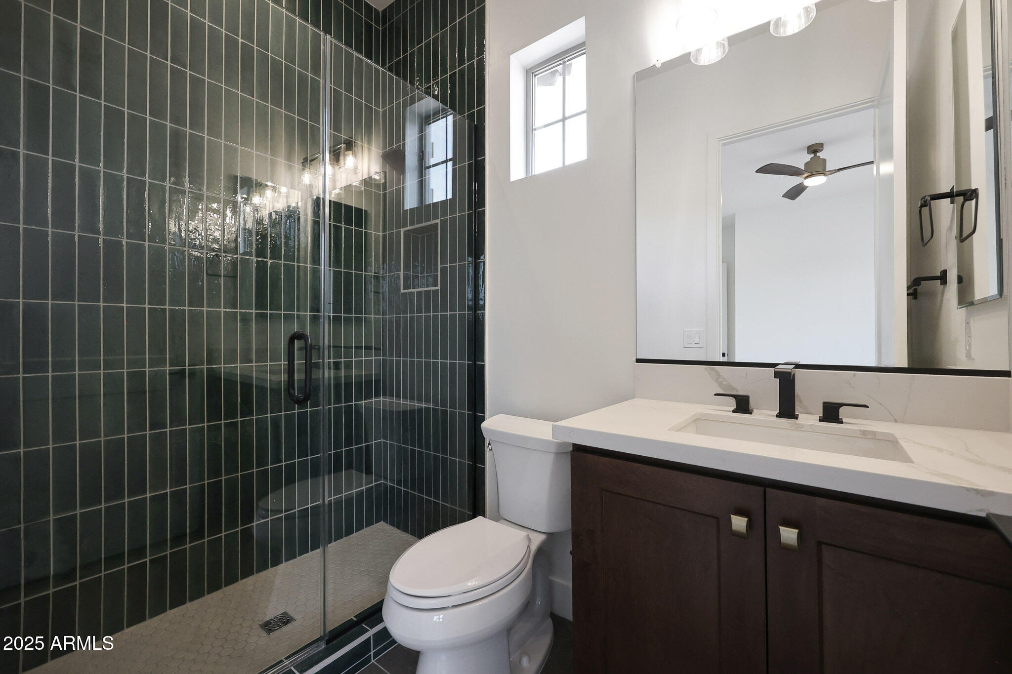 20775 West Rattler Road Buckeye, AZ 85396 - Photo 48 of 90 a bathroom with a sink toilet vanity and shower