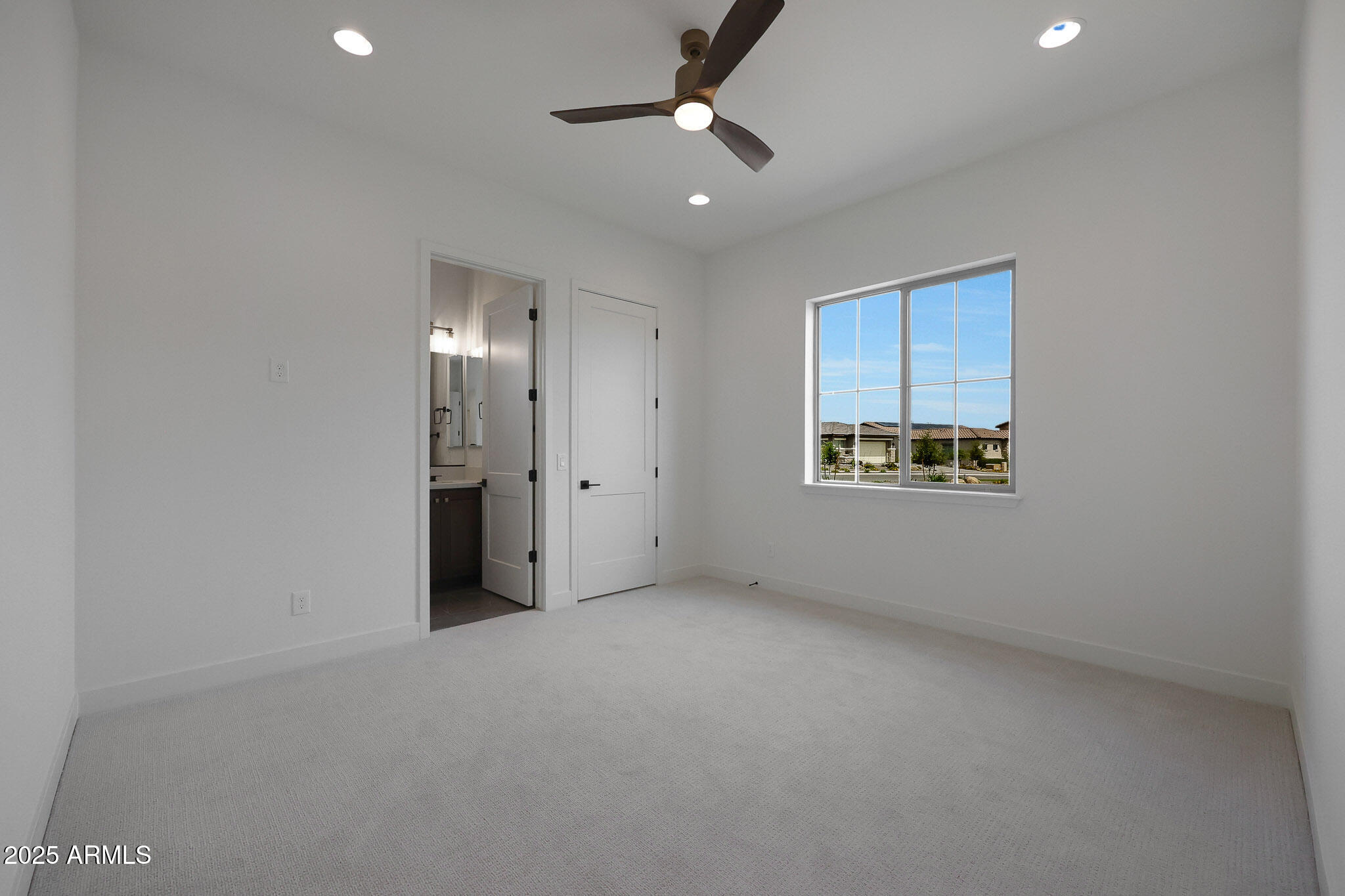 20775 West Rattler Road Buckeye, AZ 85396 - Photo 50 of 90 a view of an empty room with a window