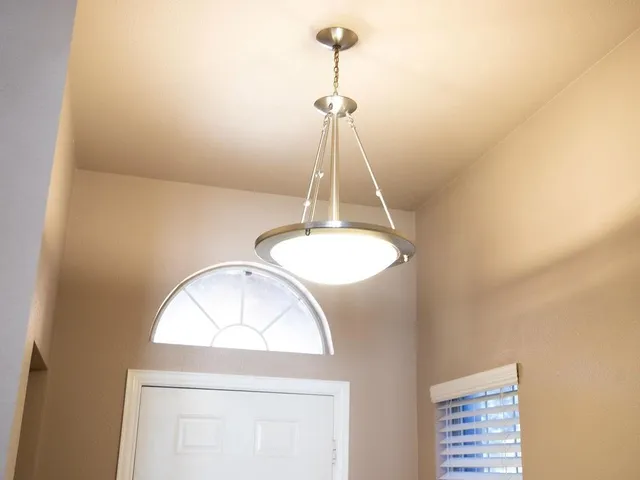 a white toilet sitting next to a small bathroom