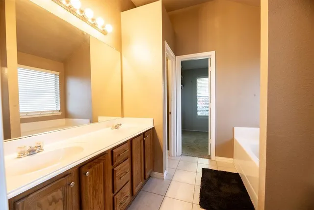 a bathroom with a bathtub and shower