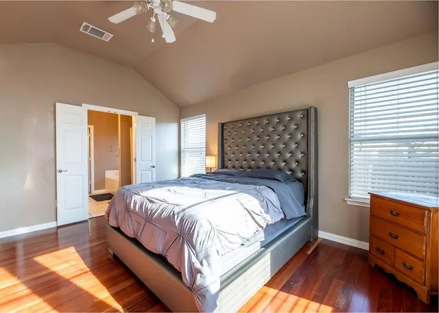 a bathroom with a sink a vanity and a bathtub