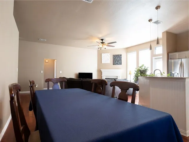 a kitchen with stainless steel appliances a counter top space cabinets and furniture