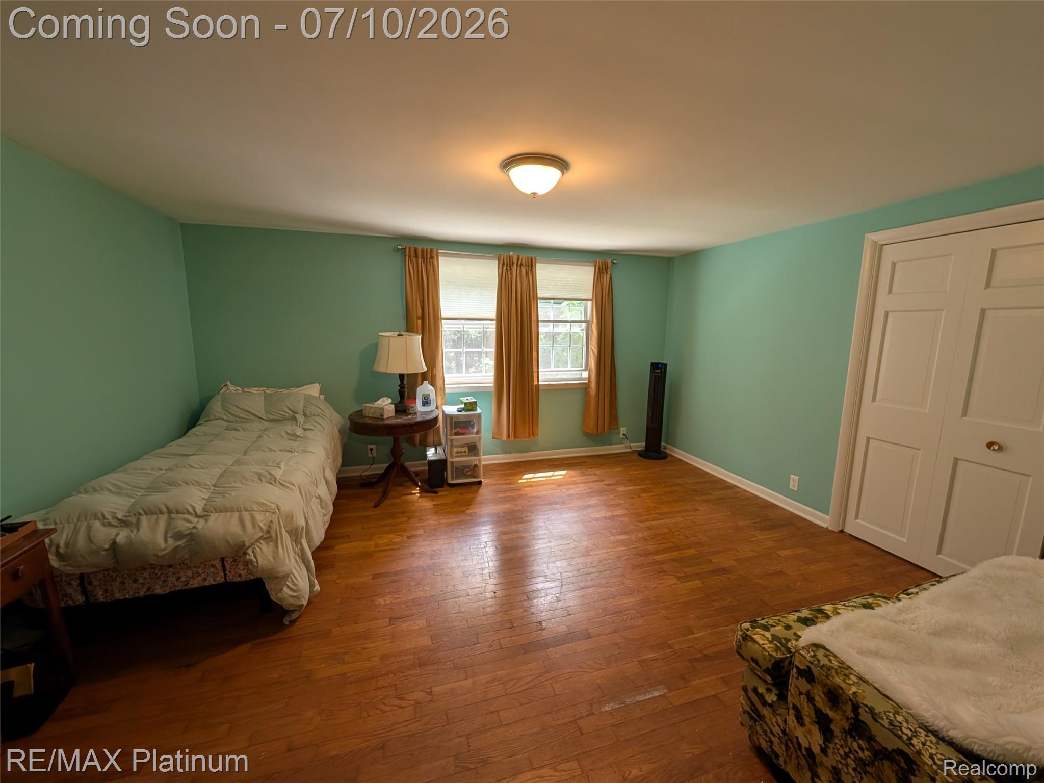 1430 Dauner Road Fenton, MI 48430 - Photo 11 of 41 Bed 1, hardwood flooring, two windows, and a double-door closet