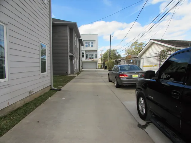 a view of a car park in front of house