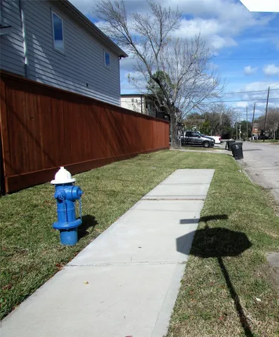 a road view of a house with a yard