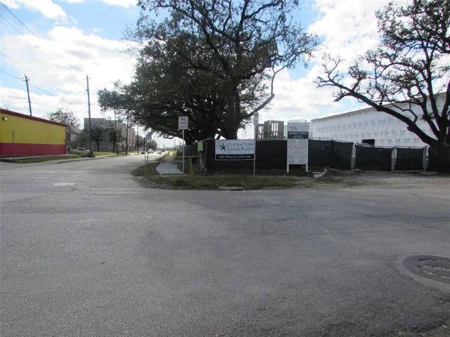 a view of a house with a tree