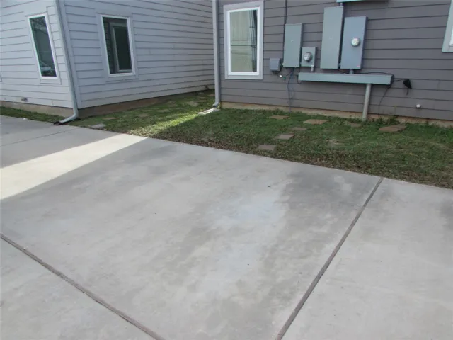 a view of house with backyard and garden