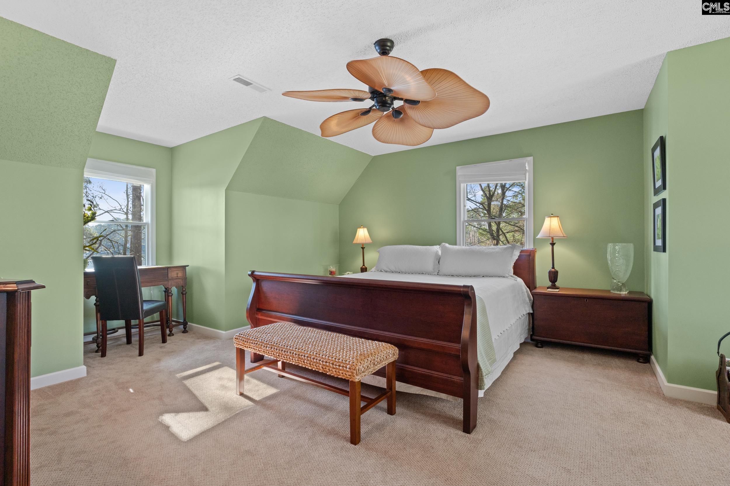 115 Rocky Ridge Road Leesville, SC 29070 - Photo 28 of 51 a bedroom with a bed a desk and chair
