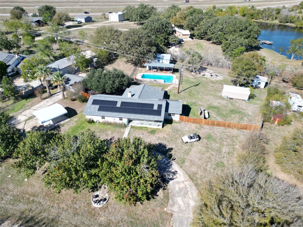 an aerial view of a house with yard swimming pool and outdoor seating