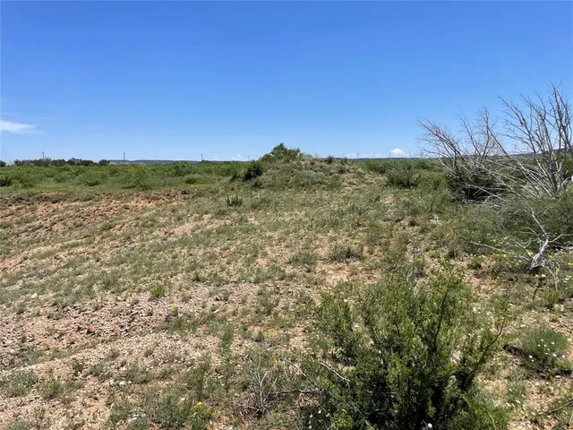 a view of a large building with a field